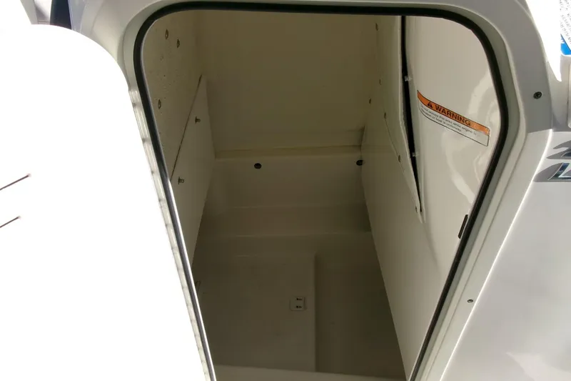Slide: The Image of 2023 NauticStar 2102 Legacy boat storage compartment interior view. - 15