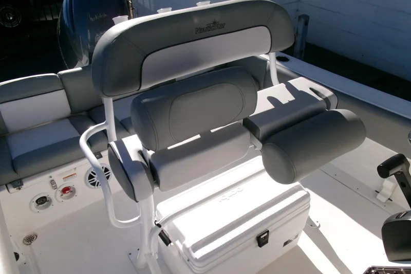 Slide: The Image of 2023 NauticStar 2102 Legacy boat interior with cushioned seating and storage. - 17