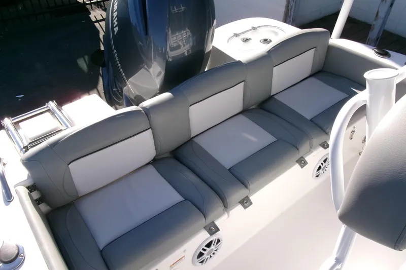 Slide: The Image of 2023 NauticStar 2102 Legacy boat with gray seating and Yamaha engine. - 19