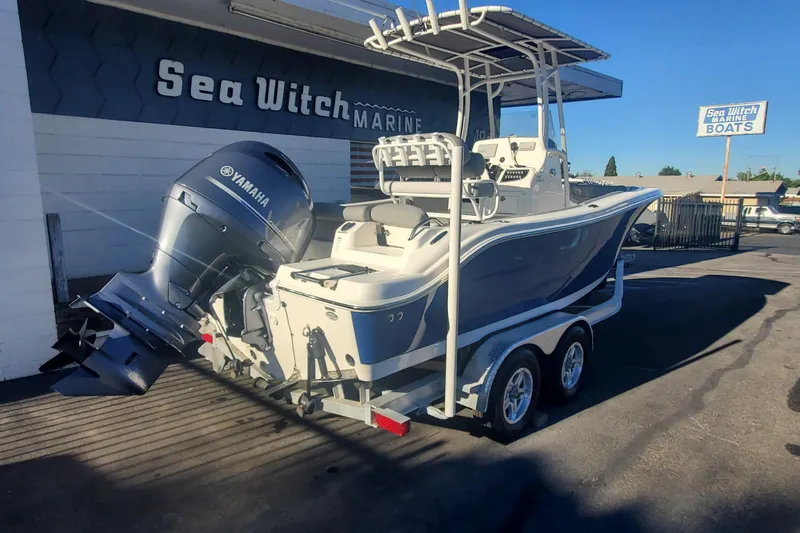 Slide: The Image of 2023 NauticStar 2102 Legacy boat with Yamaha engine at Sea Witch Marine dealership. - 2