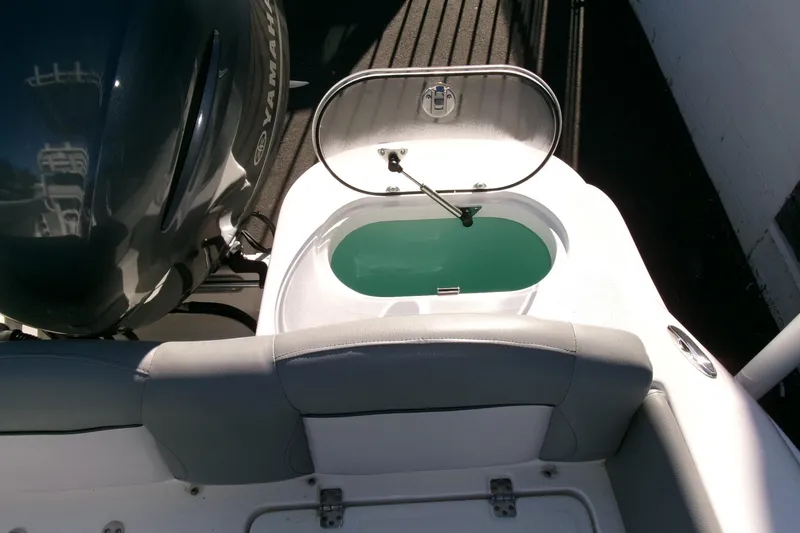 Slide: The Image of 2023 NauticStar 2102 Legacy boat with open livewell and Yamaha engine. - 23