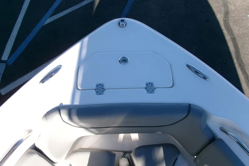 Slide: The Image of 2023 NauticStar 2102 Legacy boat bow with seating and storage compartment. - 4