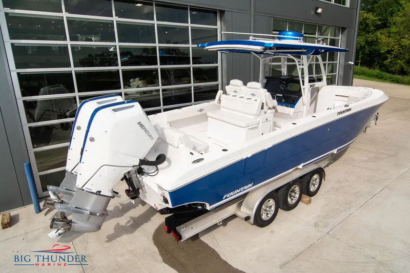 Slide: The Image of 2023 Fountain 34 Center Console boat with dual Mercury engines, parked at Big Thunder Marine. - 10