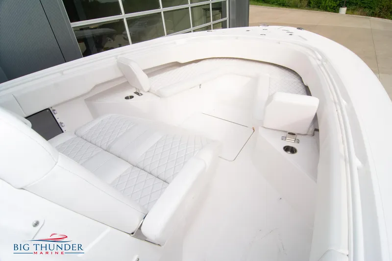 Slide: The Image of 2023 Fountain 34 Center Console boat interior with white seating and modern design. - 20