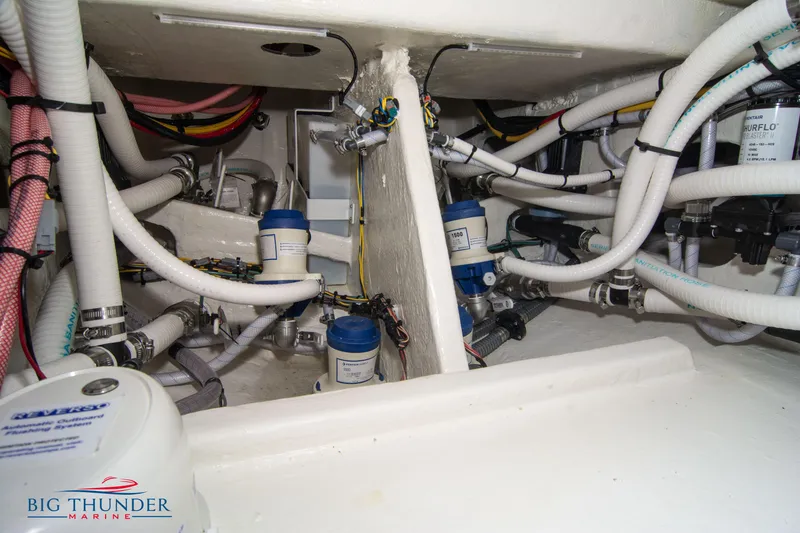 Slide: The Image of 2023 Fountain 34 Center Console boat interior with complex plumbing and wiring system. - 28