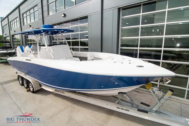 Slide: The Image of 2023 Fountain 34 Center Console boat on trailer at Big Thunder Marine dealership. - 3