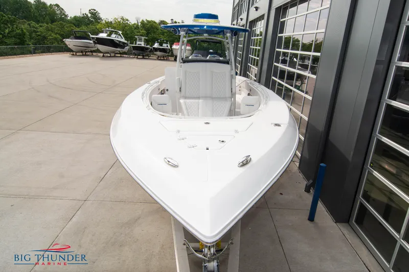 Slide: The Image of 2023 Fountain 34 Center Console boat displayed at Big Thunder Marine dealership. - 4
