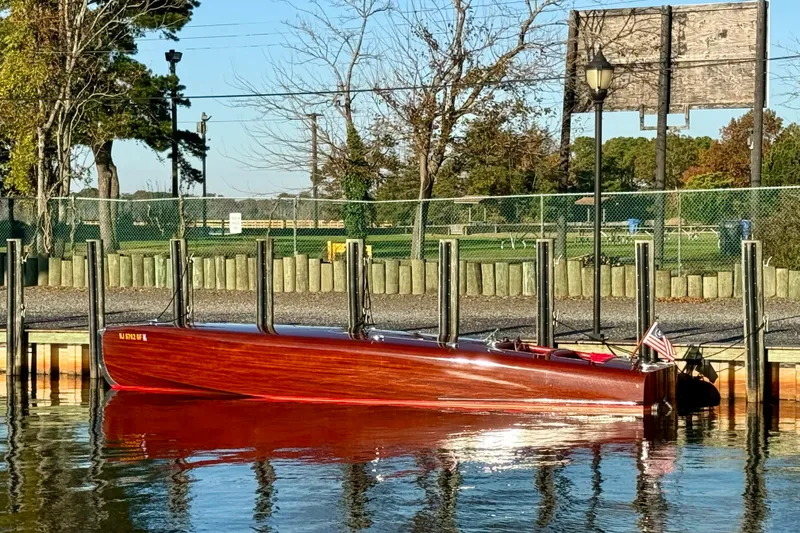 Slide: The Image of Custom 1998 30 Gentleman's Racer boat docked by a scenic waterfront. - 15