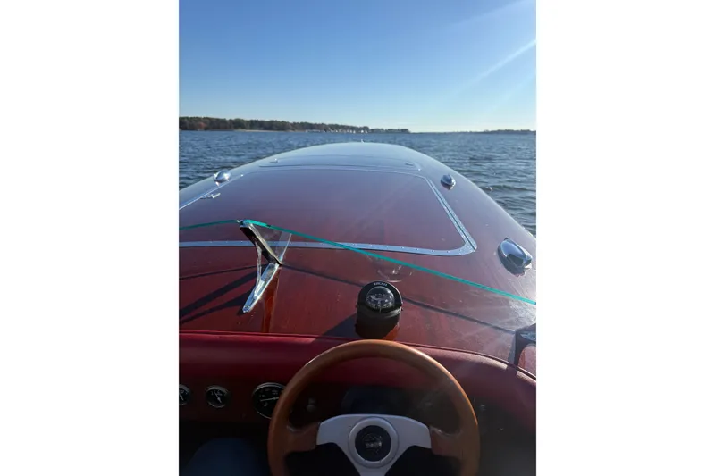 Slide: The Image of Custom 1998 30 Gentleman's Racer on water, wooden dashboard, clear sky. - 17
