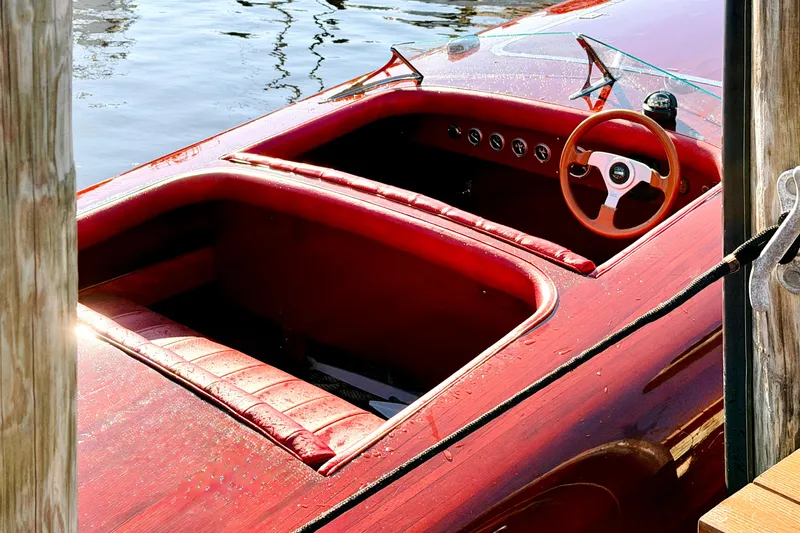 Slide: The Image of Custom 1998 30 Gentleman's Racer boat with red interior and wooden steering wheel. - 25