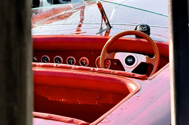Slide: The Image of Interior of a 1998 Custom 30 Gentleman's Racer with red leather and classic gauges. - 26