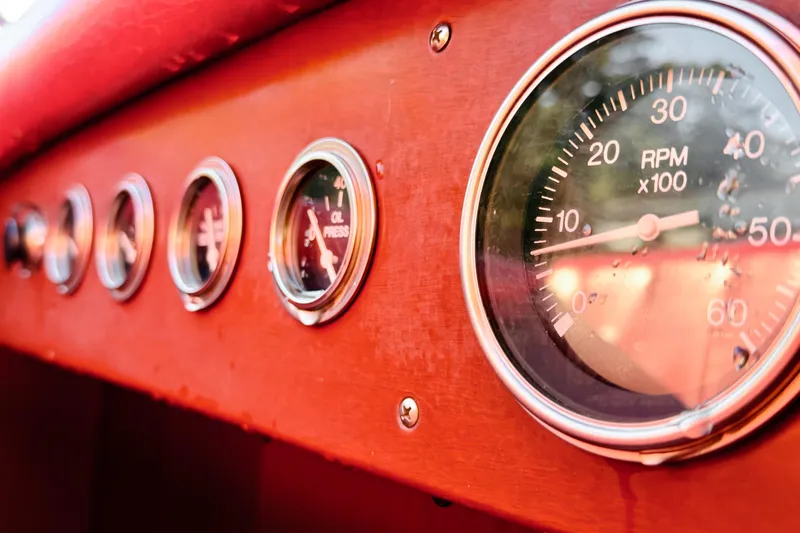 Slide: The Image of Dashboard of 1998 Custom 30 Gentleman's Racer with RPM and oil pressure gauges. - 31