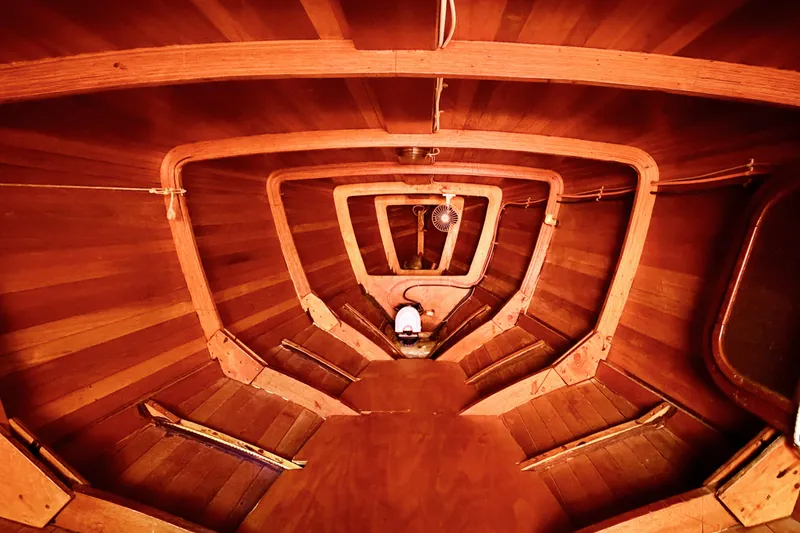 Slide: The Image of Interior view of a 1998 Custom 30 Gentleman's Racer boat, showcasing wooden craftsmanship. - 36
