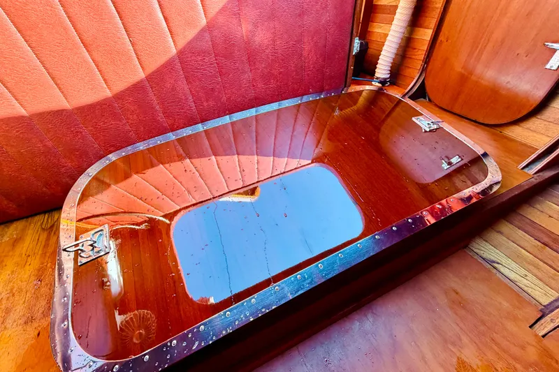 Slide: The Image of Interior of 1998 Custom 30 Gentleman's Racer with polished wood and red upholstery. - 38