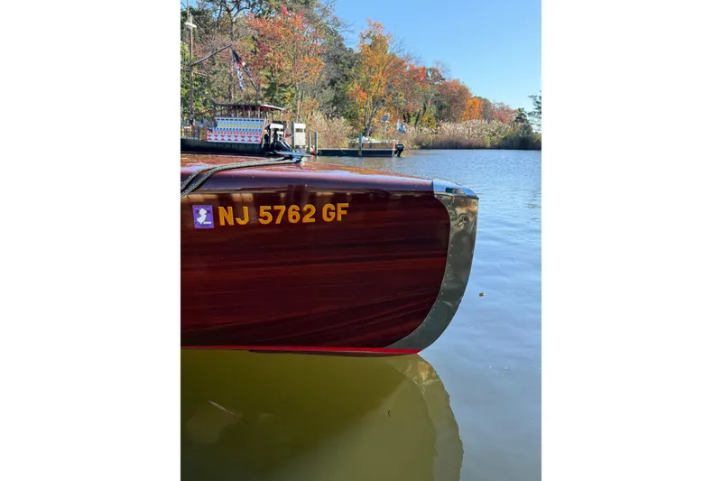 Slide: The Image of Custom 1998 30 Gentleman's Racer boat on calm water, autumn trees in background. - 42