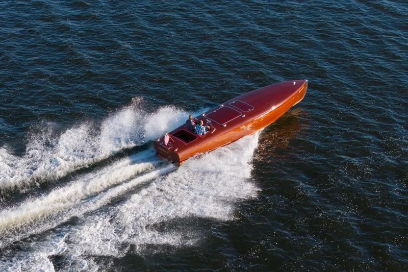 Slide: The Image of Custom 1998 30 Gentleman's Racer speeding on open water, creating a dynamic wake. - 8