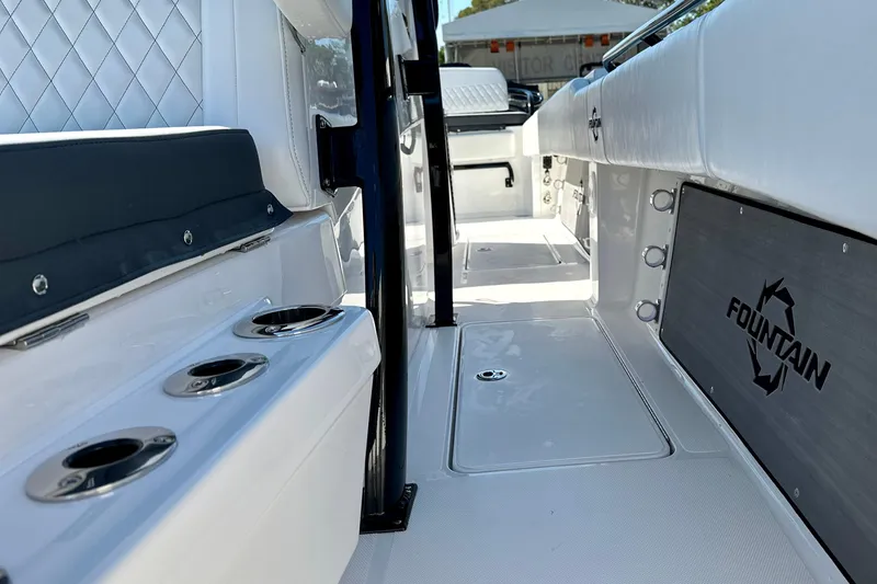 Slide: The Image of 2024 Fountain 34 Tournament Edition boat interior with sleek seating and cup holders. - 11