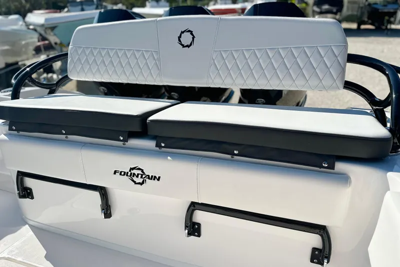 Slide: The Image of 2024 Fountain 34 Tournament Edition boat seating with diamond-stitched upholstery and logo detail. - 14