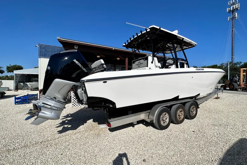 Slide: The Image of 2024 Fountain 34 Tournament Edition boat on trailer, featuring powerful Mercury outboard engines. - 3