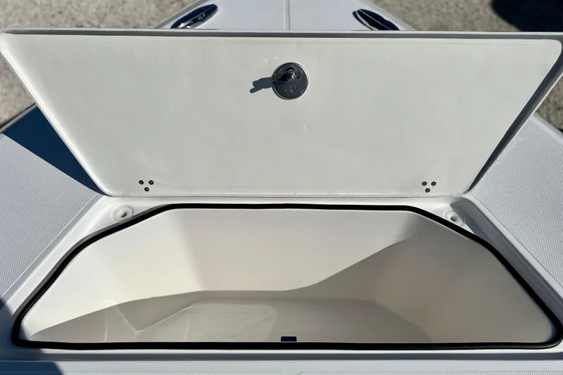 Slide: The Image of Open storage compartment on 2024 Fountain 34 Tournament Edition boat. - 6