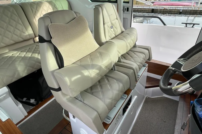 Slide: The Image of Luxurious interior of 2023 Axopar 28 Aft Cabin with Brabus Trim, featuring plush seating. - 20