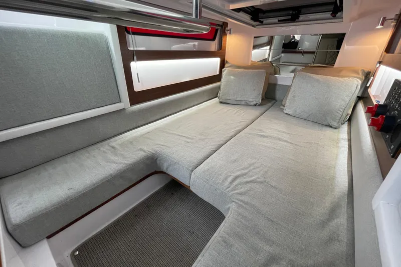 Slide: The Image of Interior of 2023 Axopar 28 Cabin with gray upholstery. - 27