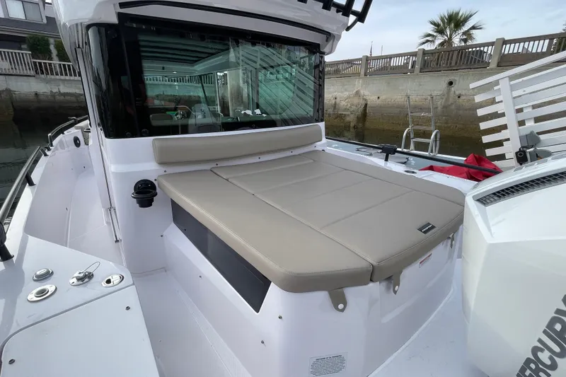 Slide: The Image of 2023 Axopar 28 Aft Cabin with Brabus Trim, featuring a spacious deck area. - 30