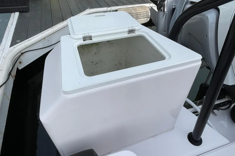 Slide: The Image of Open storage compartment on 2023 Axopar 28 Aft Cabin with Brabus Trim boat. - 33