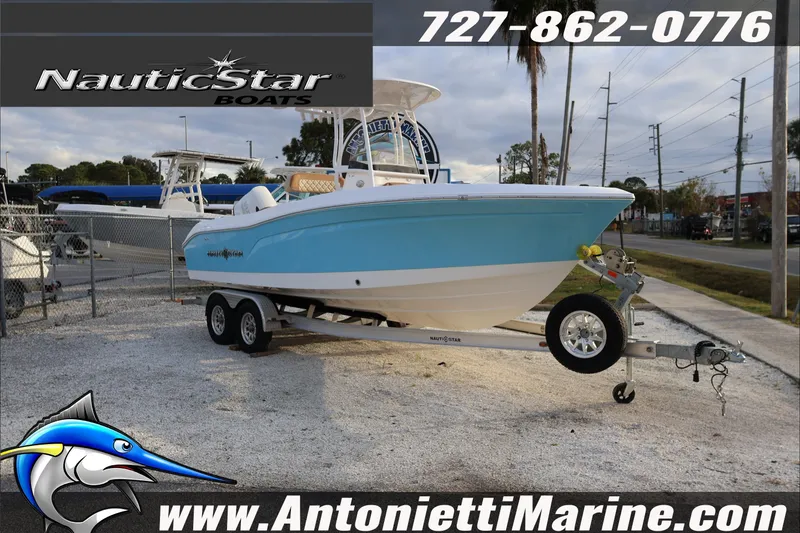 The Image of 2026 NauticStar 222 Offshore boat on trailer at Antonietti Marine dealership. - 0