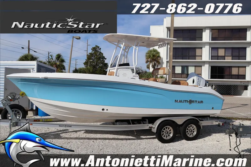 Slide: The Image of 2026 NauticStar 222 Offshore boat on trailer at Antonietti Marine dealership. - 11