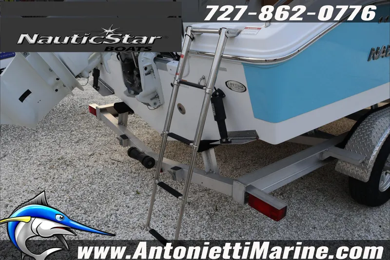 Slide: The Image of 2026 NauticStar 222 Offshore boat on trailer with ladder, displayed by Antonietti Marine. - 12