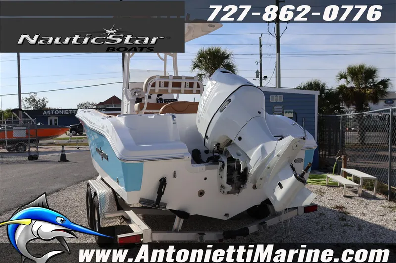 Slide: The Image of 2026 NauticStar 222 Offshore boat on trailer at Antonietti Marine dealership. - 13