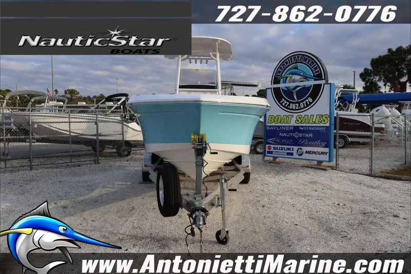 Slide: The Image of 2026 NauticStar 222 Offshore boat displayed at Antonietti Marine dealership. - 2
