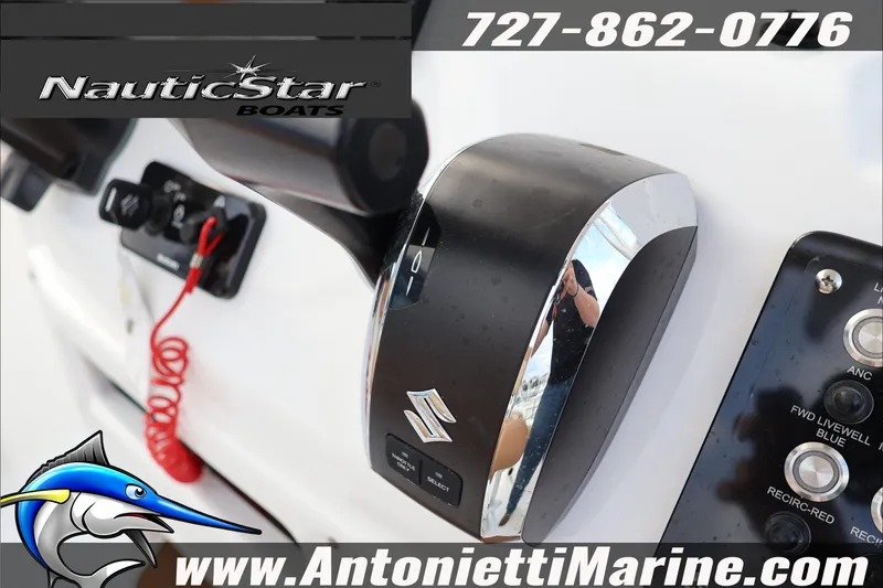 Slide: The Image of Control panel of 2026 NauticStar 222 Offshore boat with branding and contact details. - 21