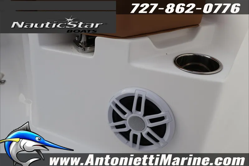 Slide: The Image of 2026 NauticStar 222 Offshore boat interior with speaker and cup holder, Antonietti Marine contact details. - 27
