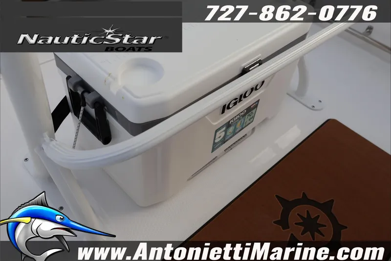 Slide: The Image of 2026 NauticStar 222 Offshore boat with Igloo cooler, contact info, and logo. - 30