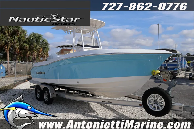 Slide: The Image of 2026 NauticStar 222 Offshore boat on trailer at Antonietti Marine dealership. - 4