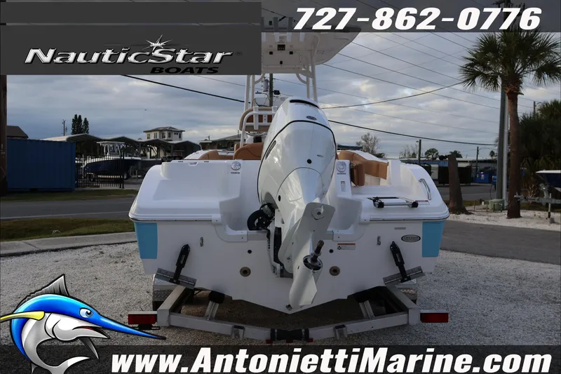 Slide: The Image of 2026 NauticStar 222 Offshore boat on trailer at Antonietti Marine dealership. - 8