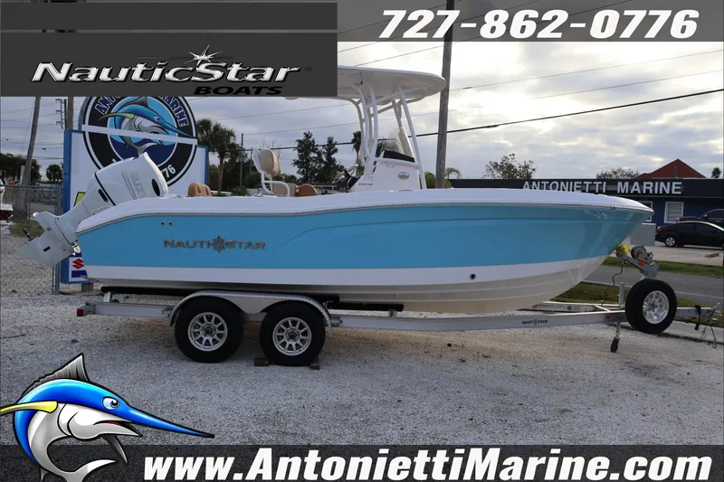 Slide: The Image of 2026 NauticStar 222 Offshore boat on trailer at Antonietti Marine dealership. - 9