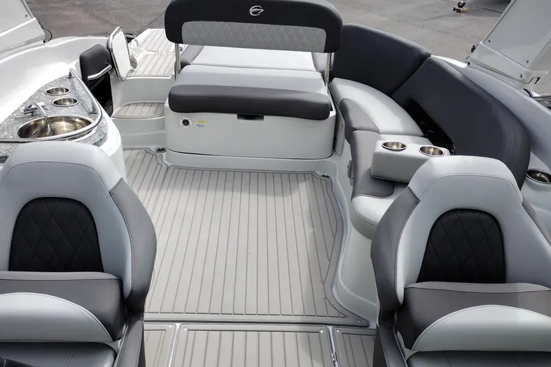 Slide: The Image of 2026 Crownline 288 SS boat interior with luxurious seating and built-in sink. - 19