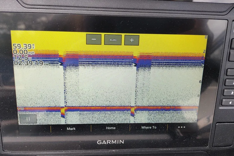 Slide: The Image of Garmin sonar display on 2026 Crownline 288 SS boat, showing water temperature and depth. - 27