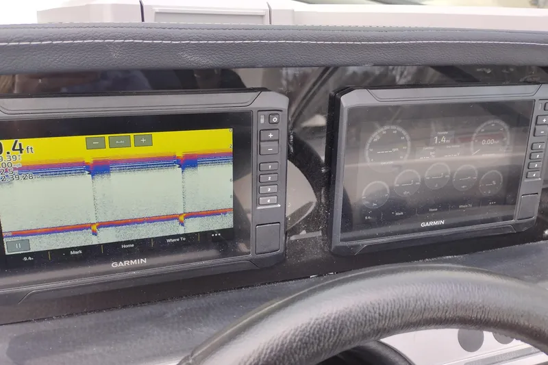 Slide: The Image of Garmin navigation displays on 2026 Crownline 288 SS boat dashboard. - 29