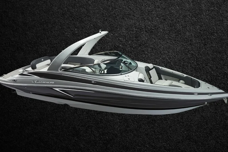 Slide: The Image of 2026 Crownline 288 SS boat with sleek design on textured black background. - 3