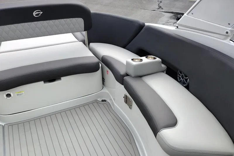 Slide: The Image of 2026 Crownline 288 SS boat interior with cushioned seating and cup holders. - 35
