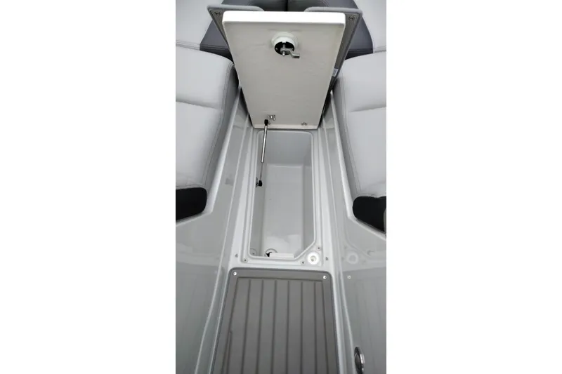 Slide: The Image of 2026 Crownline 288 SS boat storage compartment with open hatch and sleek interior design. - 46