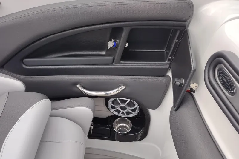 Slide: The Image of Interior of 2026 Crownline 288 SS boat with storage compartment and cup holder. - 50