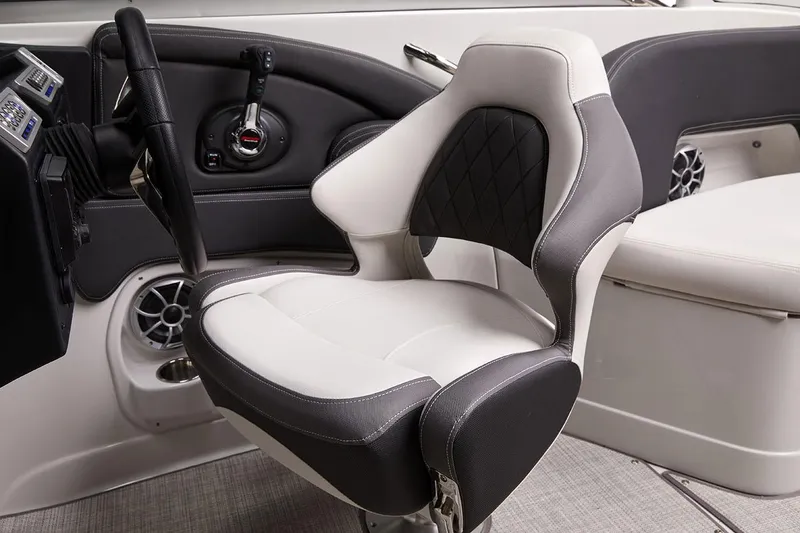 Slide: The Image of Captain's seat in 2026 Crownline 288 SS boat, featuring modern design and controls. - 6