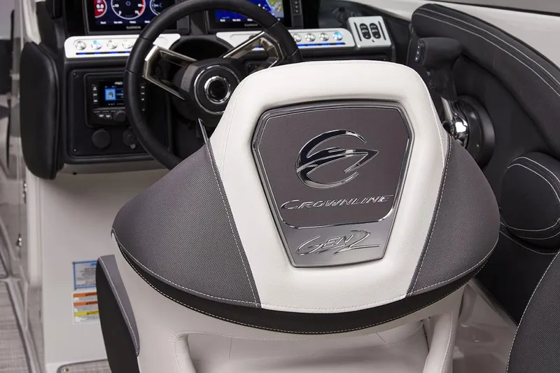 Slide: The Image of 2026 Crownline 288 SS boat helm with modern dashboard and steering wheel. - 8