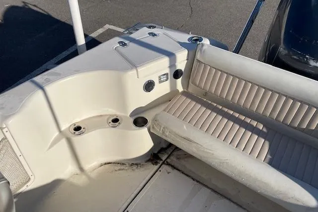 Slide: The Image of 2005 Scout 205 Dorado boat interior with seating and control panel. - 12