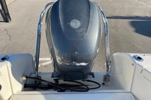 Slide: The Image of 2005 Scout 205 Dorado boat with an outboard motor, viewed from the rear. - 16